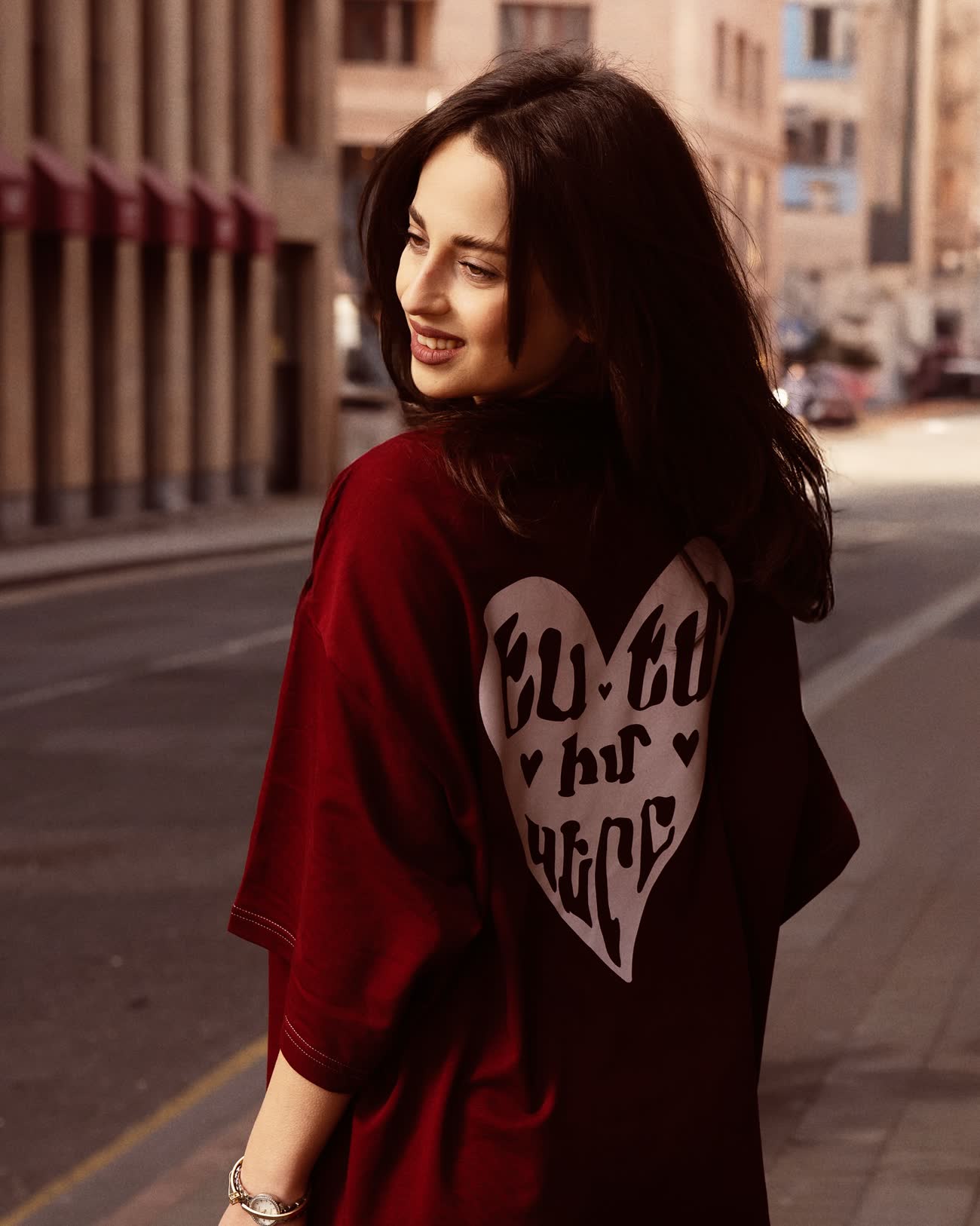The “I am the love” tee — a heart-shaped print across the back, on a Yerevan street